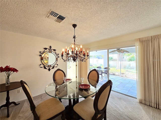 3509 Oak Lake Dr, Palm Harbor, FL 34684 - dining space with light carpet, a textured ceiling, and a chandelier