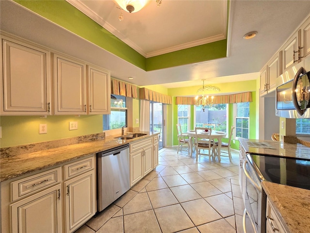 3509 Oak Lake Dr, Palm Harbor, FL 34684 - kitchen featuring appliances with stainless steel finishes, ornamental molding, a raised ceiling, a chandelier, and a sink