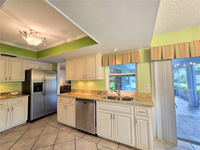 3509 Oak Lake Dr, Palm Harbor, FL 34684 - kitchen featuring appliances with stainless steel finishes, a sink, light stone countertops, light tile patterned floors, and ornamental molding