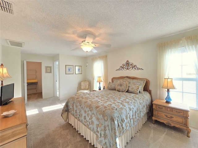 3509 Oak Lake Dr, Palm Harbor, FL 34684 - bedroom featuring light colored carpet, a textured ceiling, and ceiling fan