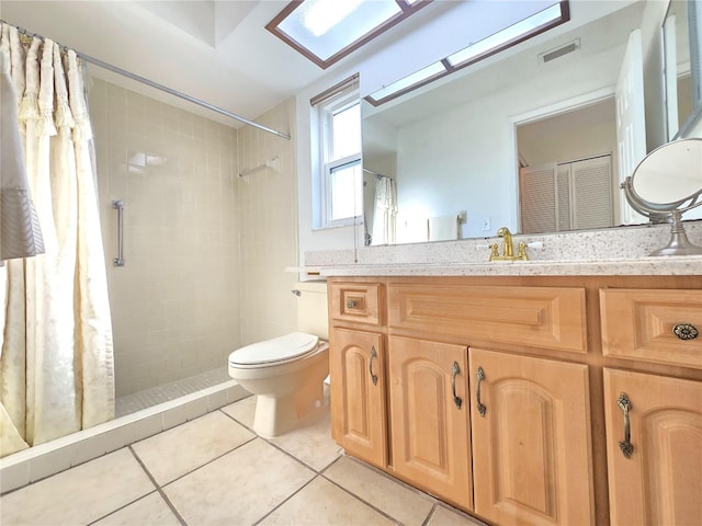 3509 Oak Lake Dr, Palm Harbor, FL 34684 - bathroom with tile patterned floors, toilet, vanity, and a tile shower