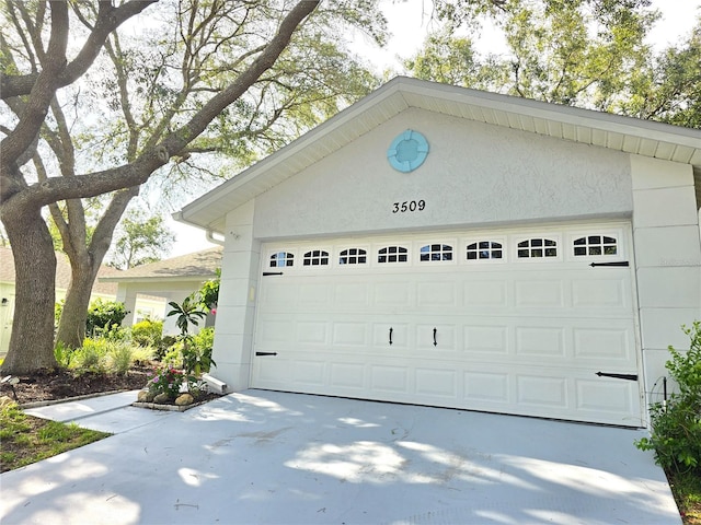 3509 Oak Lake Dr, Palm Harbor, FL 34684 - garage featuring concrete driveway