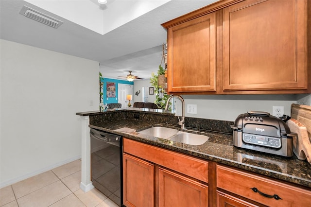 704 Lyndhurst St Unit 624, Dunedin, FL 34698 - kitchen with dishwasher, a sink, light tile patterned floors, and brown cabinets