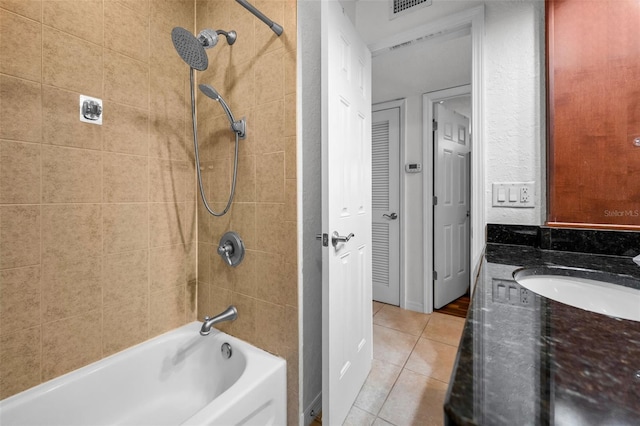 704 Lyndhurst St Unit 624, Dunedin, FL 34698 - bathroom featuring tile patterned floors, washtub / shower combination, and vanity