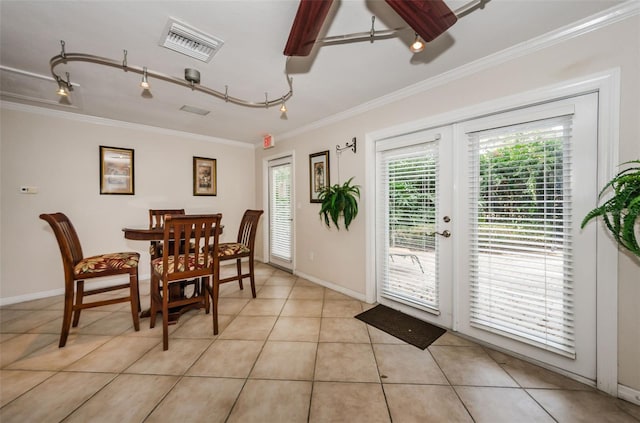 704 Lyndhurst St Unit 624, Dunedin, FL 34698 - dining space featuring ornamental molding, french doors, light tile patterned floors, a ceiling fan, and baseboards