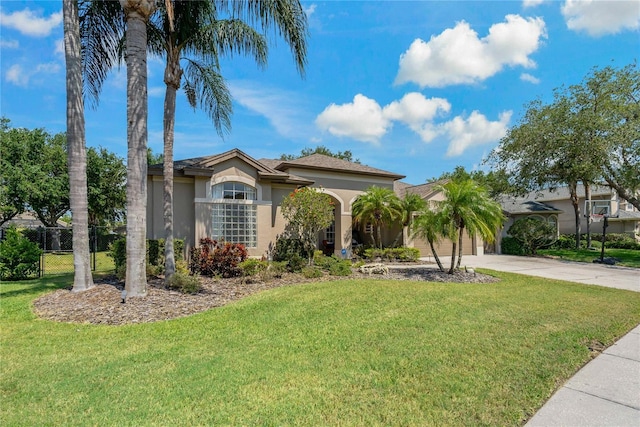 4530 Roanoak Way, Palm Harbor, FL 34685 - mediterranean / spanish-style house featuring concrete driveway, stucco siding, and an attached garage