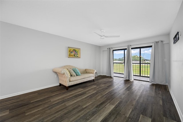 9450 Harbor Greens Way Unit 207, Seminole, FL 33776 - sitting room featuring dark wood-style floors, baseboards, and ceiling fan