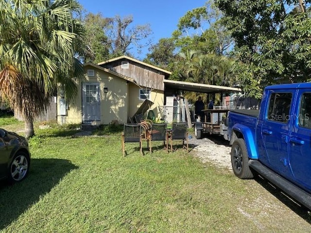 3512 16th St E, Bradenton, FL 34208 - view of side of home featuring a lawn