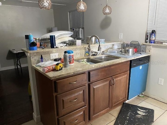 3512 16th St E, Bradenton, FL 34208 - kitchen featuring dishwashing machine, a sink, cooling unit, light stone countertops, and light tile patterned flooring