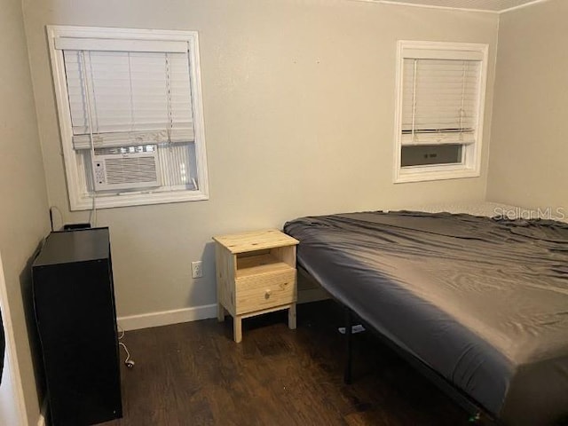 3512 16th St E, Bradenton, FL 34208 - bedroom featuring dark wood-type flooring, baseboards, and cooling unit