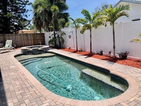 14530 Apache Ave, Largo, FL 33774 - view of swimming pool with a fenced backyard, a patio, and a pool with connected hot tub