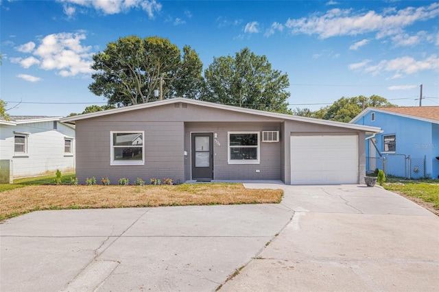 5326 22nd Ave N, Saint Petersburg, FL 33710 - single story home with concrete driveway and an attached garage