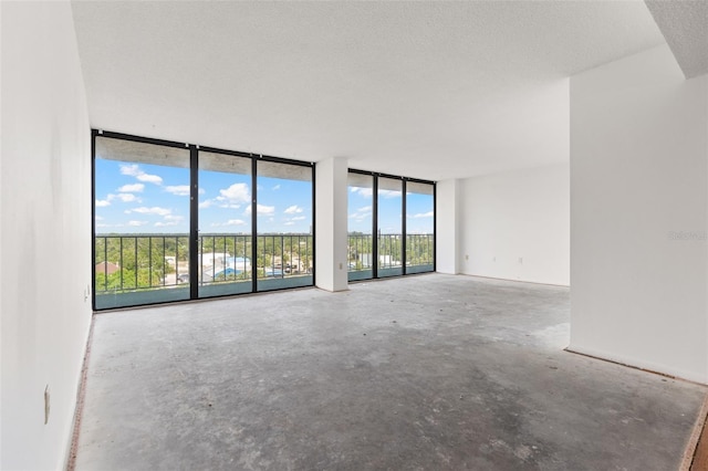 500 N Osceola Ave Unit 811, Clearwater, FL 33755 - spare room featuring floor to ceiling windows and concrete floors