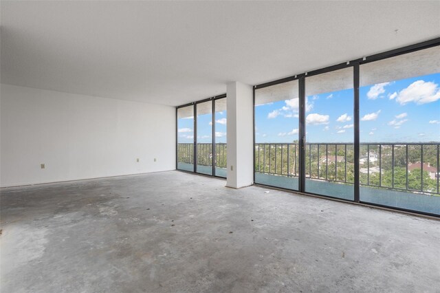 500 N Osceola Ave Unit 811, Clearwater, FL 33755 - empty room with expansive windows and concrete floors