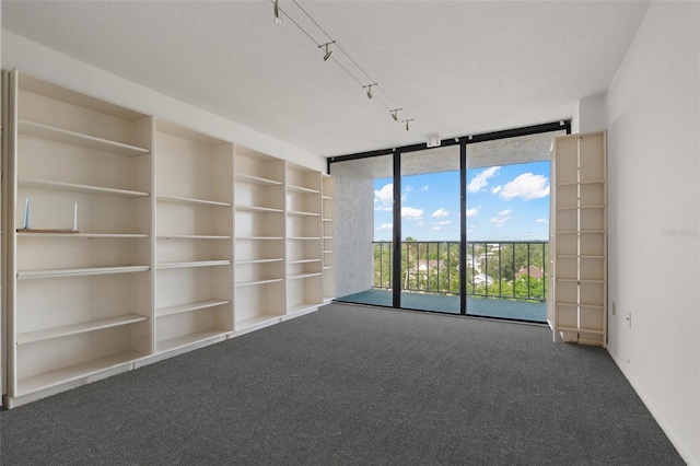 500 N Osceola Ave Unit 811, Clearwater, FL 33755 - unfurnished room featuring carpet flooring, a wall of windows, and built in features