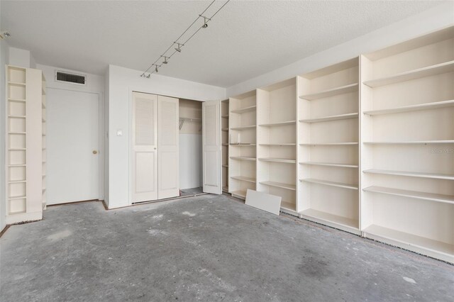 500 N Osceola Ave Unit 811, Clearwater, FL 33755 - unfurnished bedroom featuring concrete flooring and a closet