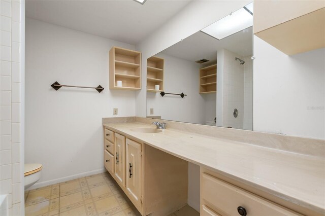 500 N Osceola Ave Unit 811, Clearwater, FL 33755 - bathroom featuring toilet, tile patterned floors, vanity, a shower, and baseboards