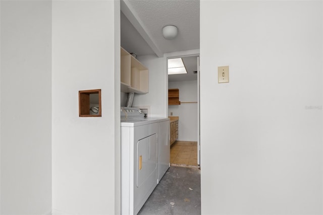 500 N Osceola Ave Unit 811, Clearwater, FL 33755 - laundry room featuring independent washer and dryer and a textured ceiling