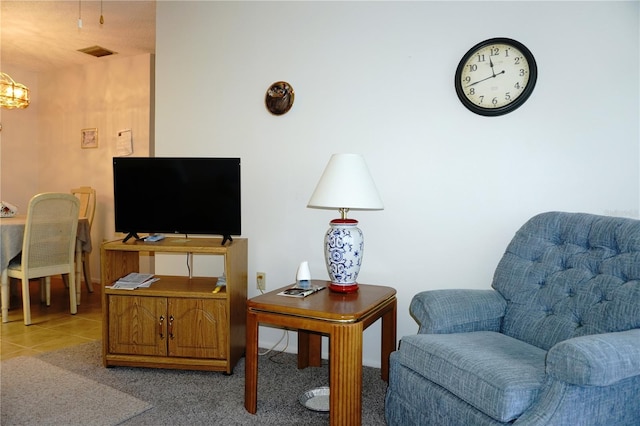 4324 Tahitian Gardens Cir Unit J, Holiday, FL 34691 - living area with tile patterned floors and a chandelier