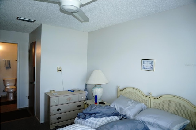 4324 Tahitian Gardens Cir Unit J, Holiday, FL 34691 - bedroom with a textured ceiling, ensuite bathroom, and ceiling fan