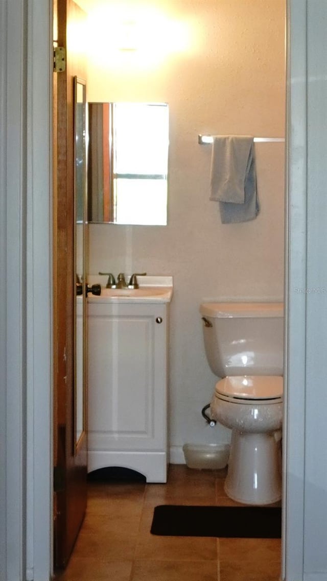 4324 Tahitian Gardens Cir Unit J, Holiday, FL 34691 - bathroom featuring vanity, toilet, and wood finished floors
