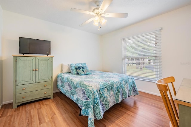 2700 Bayshore Blvd Unit 497, Dunedin, FL 34698 - bedroom with light wood-style flooring, baseboards, and ceiling fan