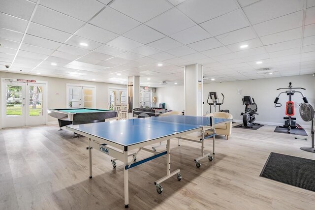 2700 Bayshore Blvd Unit 497, Dunedin, FL 34698 - rec room with french doors, light wood-style flooring, baseboards, pool table, and a paneled ceiling