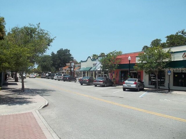 2700 Bayshore Blvd Unit 497, Dunedin, FL 34698 - view of asphalt road featuring sidewalks, curbs, and street lighting