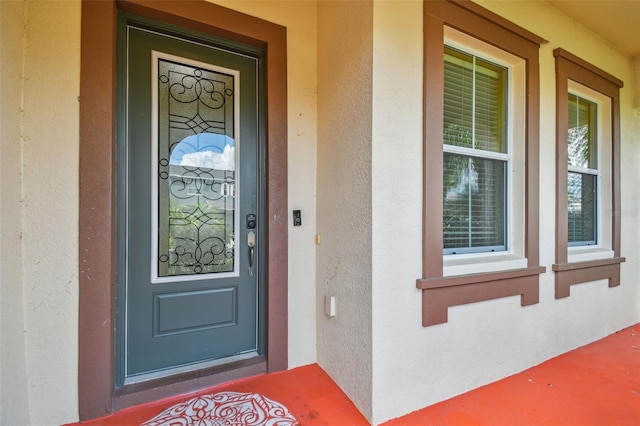 4089 Windcrest Dr, Wesley Chapel, FL 33544 - property entrance featuring stucco siding and a porch