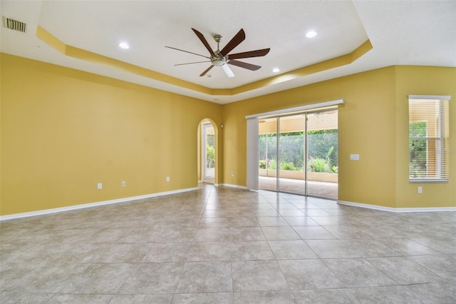 4089 Windcrest Dr, Wesley Chapel, FL 33544 - unfurnished room with a raised ceiling, a ceiling fan, arched walkways, baseboards, and recessed lighting