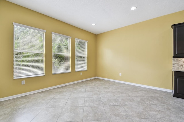 4089 Windcrest Dr, Wesley Chapel, FL 33544 - empty room featuring light tile patterned flooring, recessed lighting, and baseboards