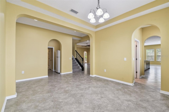 4089 Windcrest Dr, Wesley Chapel, FL 33544 - tiled empty room featuring a chandelier, stairs, and baseboards