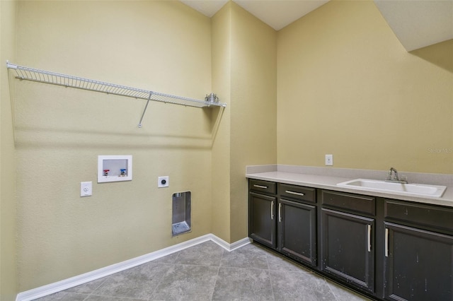 4089 Windcrest Dr, Wesley Chapel, FL 33544 - laundry area with electric dryer hookup, hookup for a washing machine, cabinet space, light tile patterned floors, and baseboards