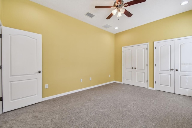 4089 Windcrest Dr, Wesley Chapel, FL 33544 - unfurnished bedroom featuring two closets, carpet flooring, baseboards, and recessed lighting