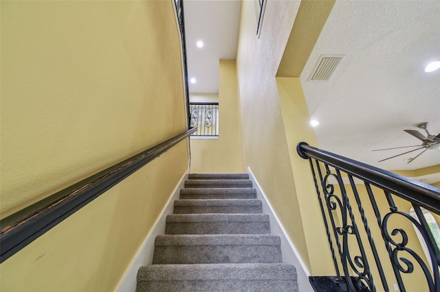 4089 Windcrest Dr, Wesley Chapel, FL 33544 - stairs featuring ceiling fan, baseboards, a textured wall, and recessed lighting