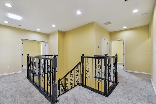 4089 Windcrest Dr, Wesley Chapel, FL 33544 - hall with an upstairs landing, carpet flooring, recessed lighting, and baseboards
