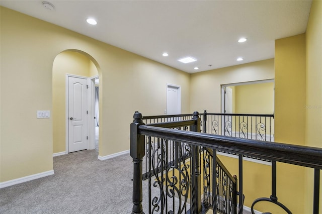 4089 Windcrest Dr, Wesley Chapel, FL 33544 - corridor featuring an upstairs landing, carpet floors, arched walkways, recessed lighting, and baseboards