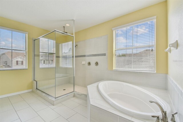 4089 Windcrest Dr, Wesley Chapel, FL 33544 - full bathroom with a bath, a stall shower, tile patterned flooring, and healthy amount of natural light