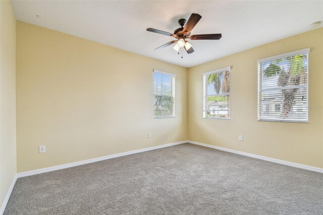 4089 Windcrest Dr, Wesley Chapel, FL 33544 - unfurnished room featuring carpet, baseboards, and ceiling fan
