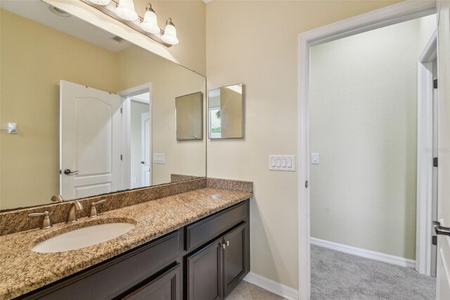 4089 Windcrest Dr, Wesley Chapel, FL 33544 - bathroom with vanity and baseboards