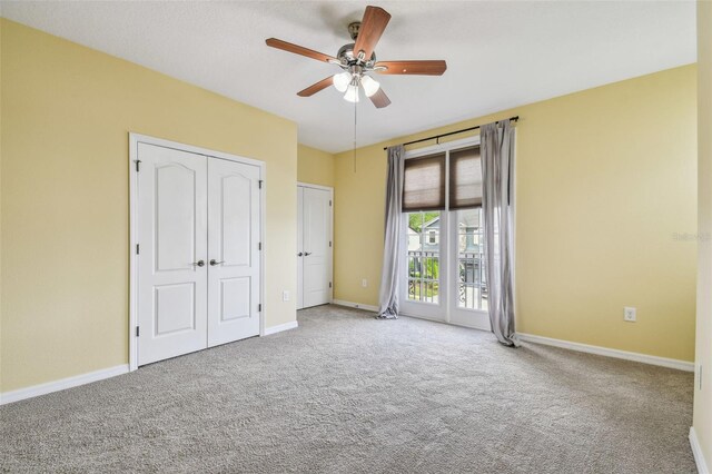 4089 Windcrest Dr, Wesley Chapel, FL 33544 - unfurnished bedroom with carpet floors, access to exterior, baseboards, and ceiling fan