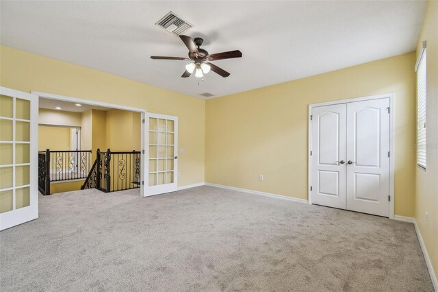 4089 Windcrest Dr, Wesley Chapel, FL 33544 - carpeted spare room featuring a ceiling fan, baseboards, and french doors