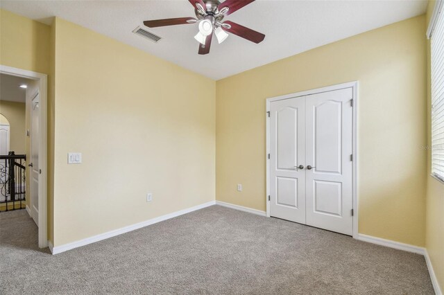 4089 Windcrest Dr, Wesley Chapel, FL 33544 - unfurnished bedroom with carpet floors, baseboards, and ceiling fan