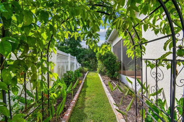 4089 Windcrest Dr, Wesley Chapel, FL 33544 - view of yard featuring a sunroom