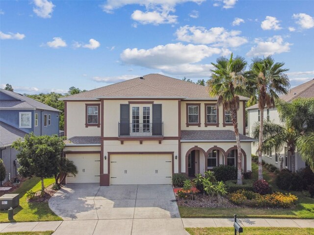 4089 Windcrest Dr, Wesley Chapel, FL 33544 - view of front of home featuring stucco siding, an attached garage, concrete driveway, and a shingled roof