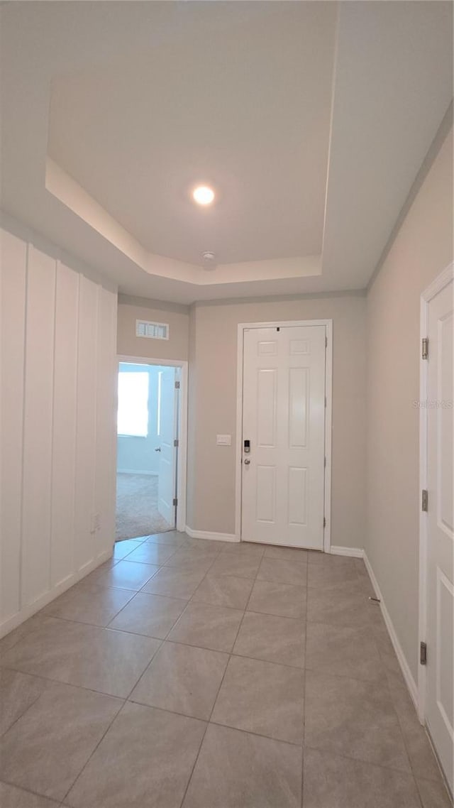 13111 Pepper Stem St, Spring Hill, FL 34609 - entrance foyer with a raised ceiling, light tile patterned flooring, baseboards, and recessed lighting