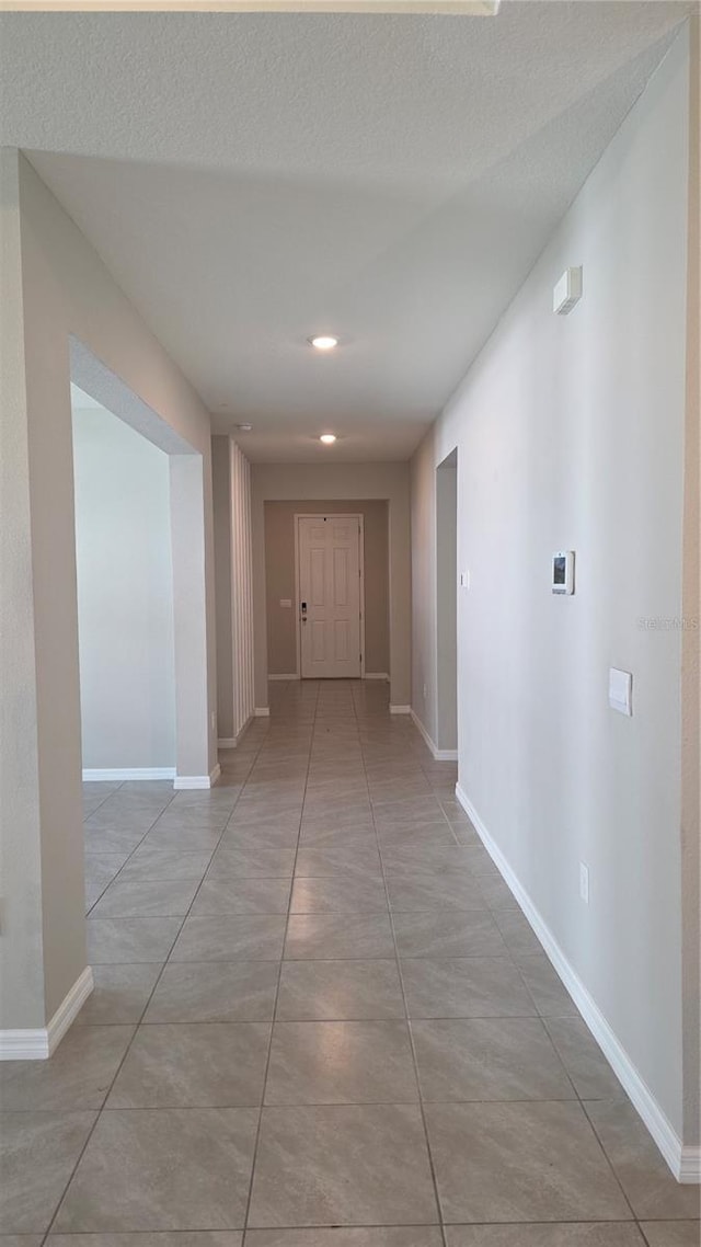 13111 Pepper Stem St, Spring Hill, FL 34609 - corridor featuring baseboards and recessed lighting