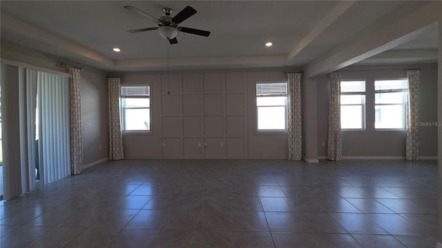 13111 Pepper Stem St, Spring Hill, FL 34609 - spare room with a raised ceiling, baseboards, tile patterned floors, a ceiling fan, and recessed lighting