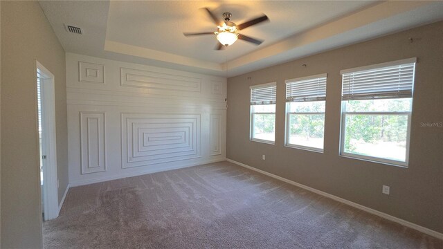13111 Pepper Stem St, Spring Hill, FL 34609 - unfurnished bedroom featuring carpet, a raised ceiling, baseboards, and ceiling fan