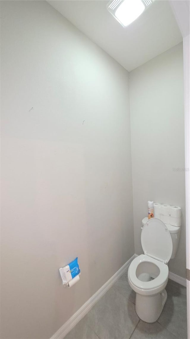 13111 Pepper Stem St, Spring Hill, FL 34609 - bathroom with toilet, baseboards, and tile patterned floors